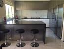 Gloss white, gloss stainless steel and Black Pearl granite kitchen